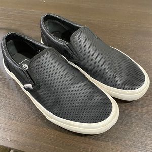 Vans black leather slip ons